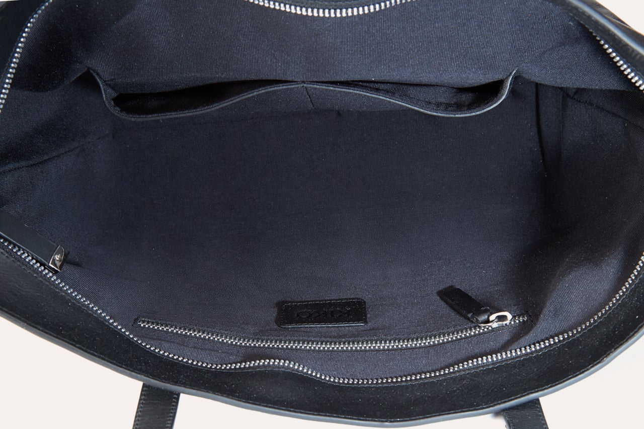 Bolso tote de cuero genuino con cremallera media: un paradigma de estilo y funcionalidad